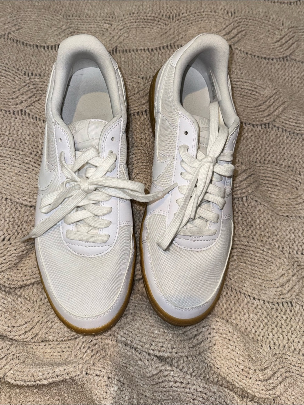 Nike White Low-Top Sneakers with Black Swoosh
